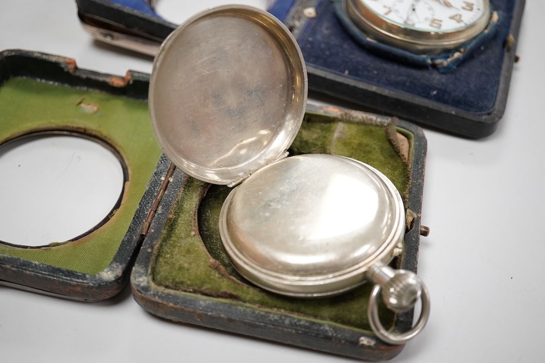 Two George V silver mounted travelling watch cases, both Birmingham, 1921, both containing chrome cased pocket watches. largest case 11.4cm.